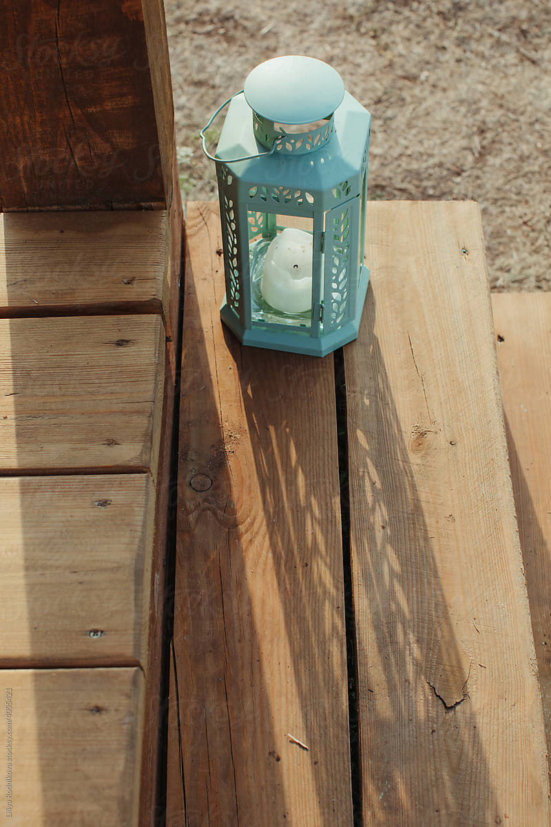 Vintage lantern with candle on step