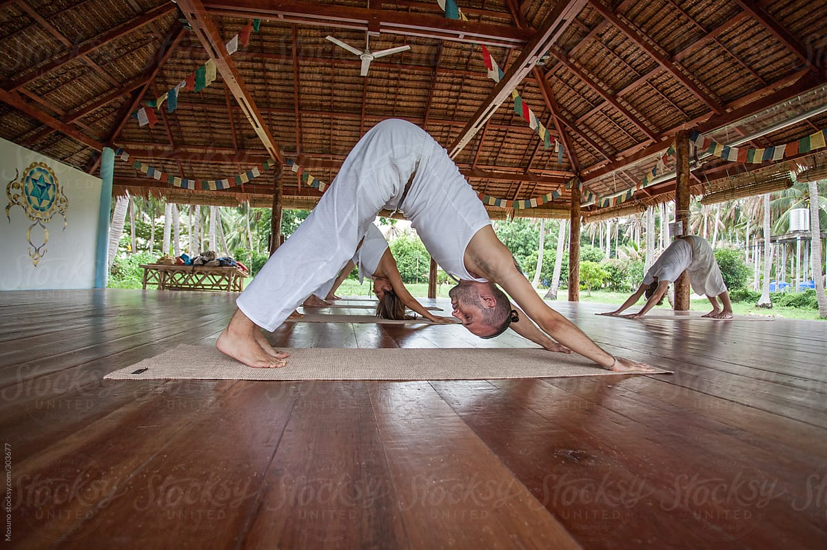 Yoga Class In A Beautiful Hall Made Of Bamboo by Stocksy Contributor  Mosuno - Stocksy