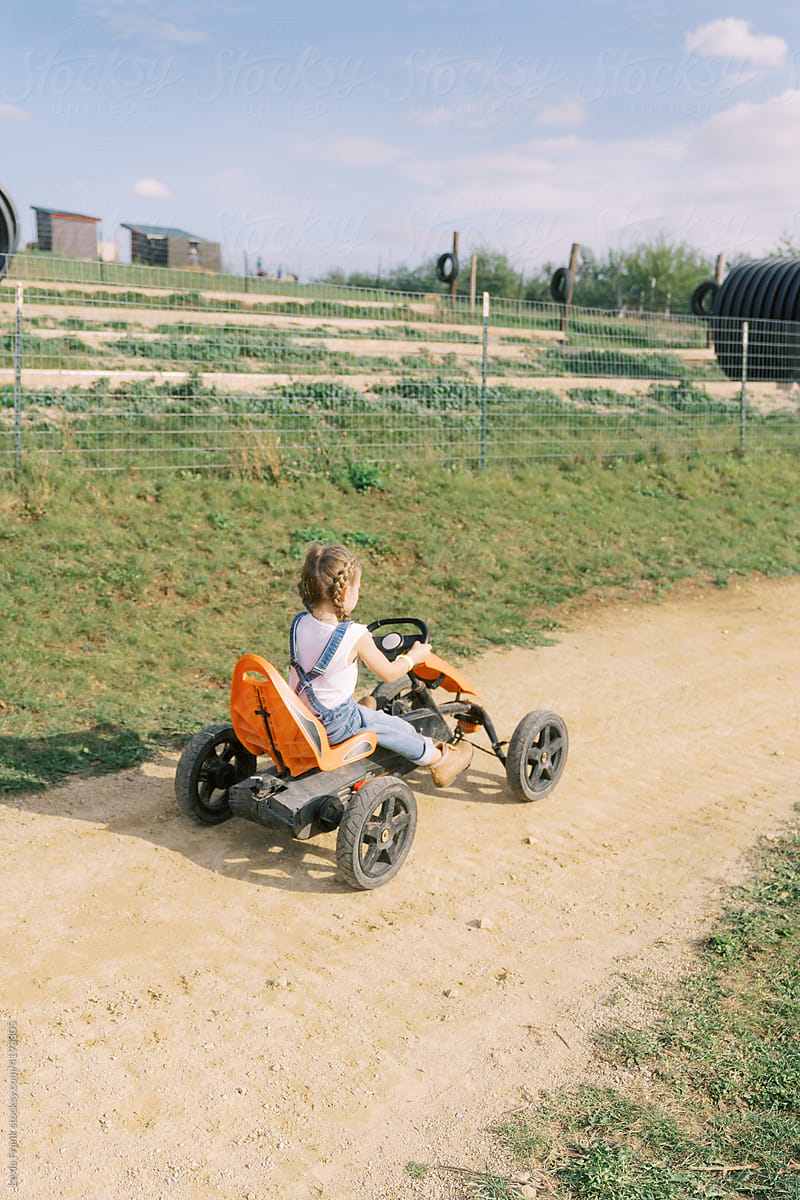 farm girl drives go cart