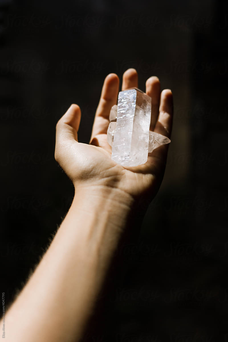 Hand holding a crystal