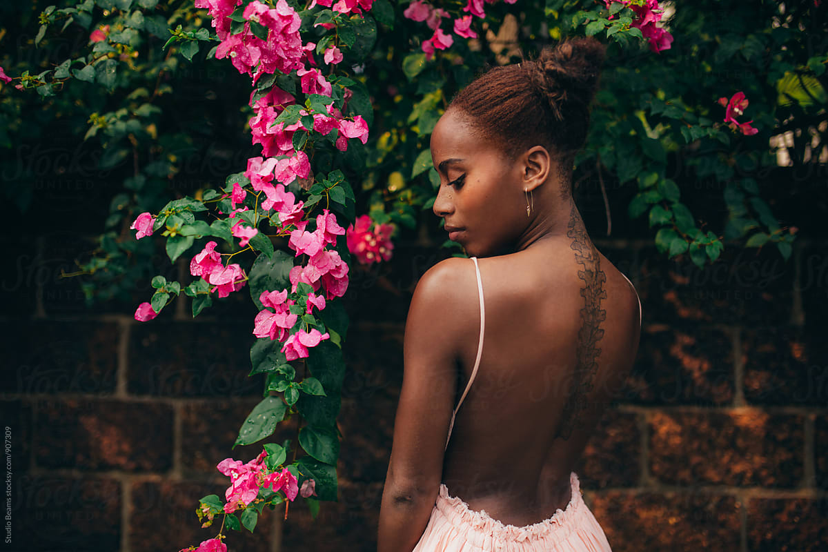 Beautiful Woman In Garden" by Stocksy Contributor "Maia Images" - Stocksy