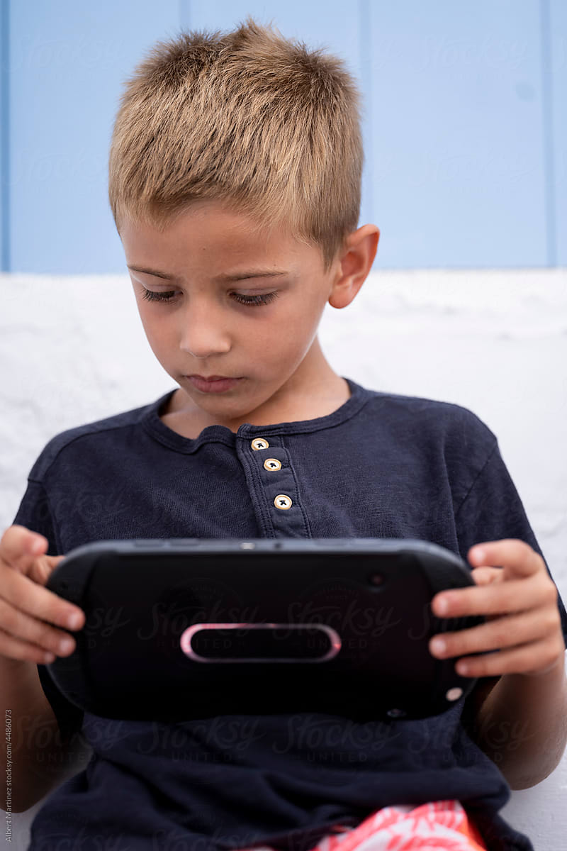 Little kid with portable console