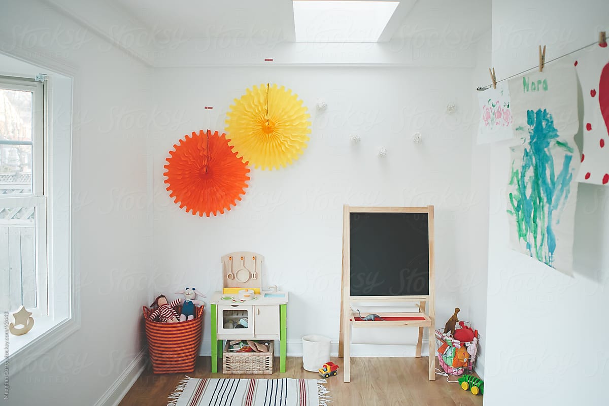 playroom with toys, chalkboard and kitchen