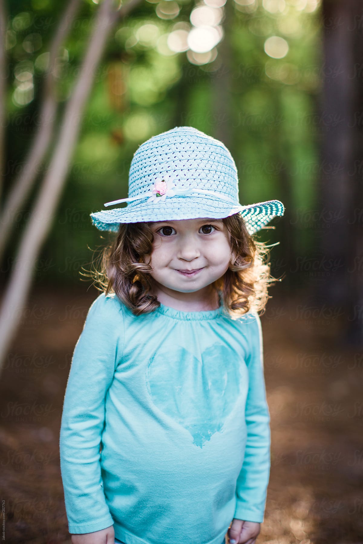 Adorable Young Girl Wearing A Blue Hat By Jakob Lagerstedt 