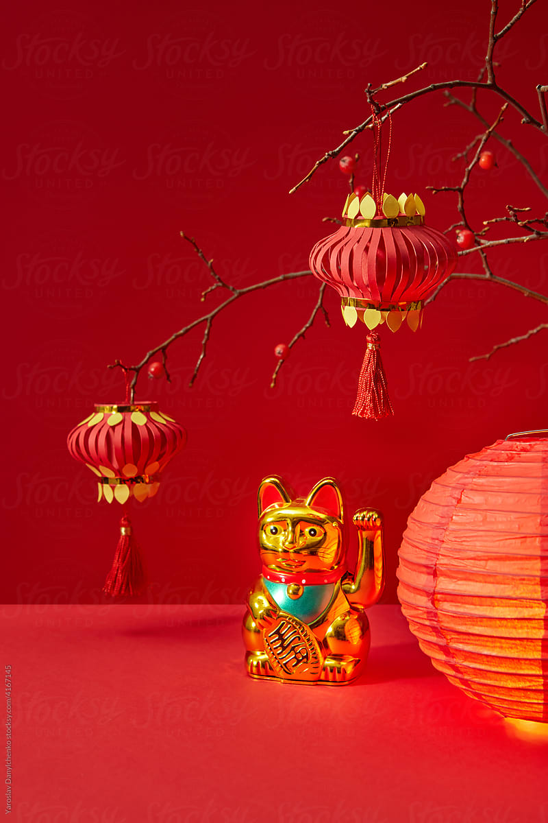 Chinese lucky cat near lanterns
