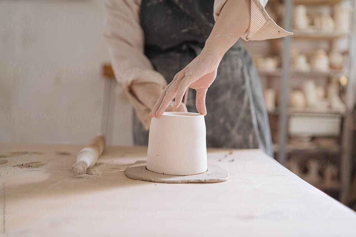 young woman working in a pottery workshop