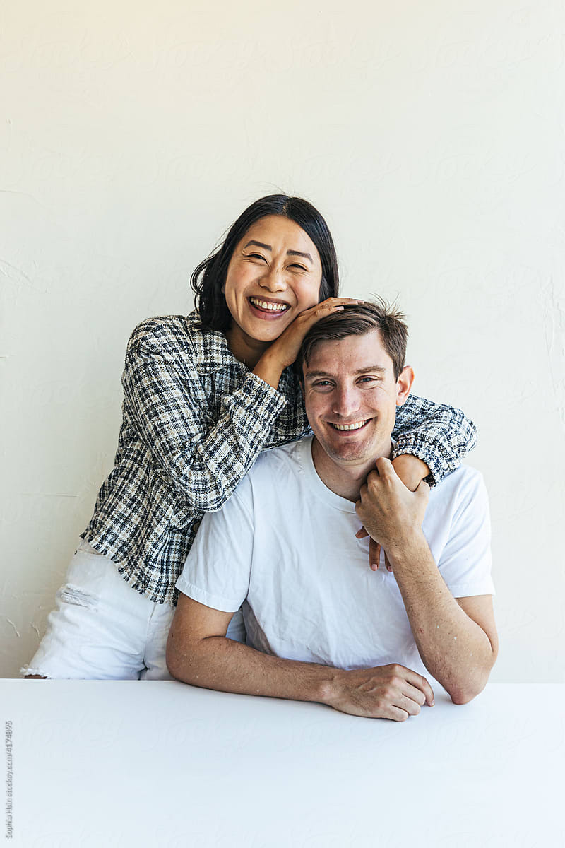 Young couple smiling at camera