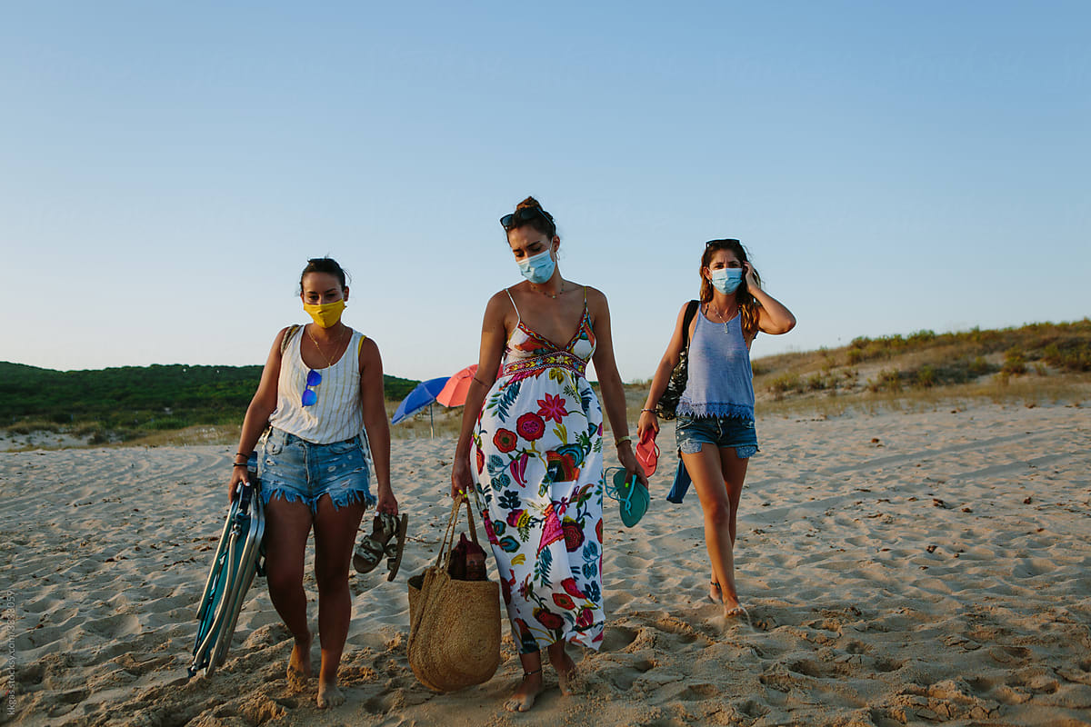 Arriving at the beach wearing face masks