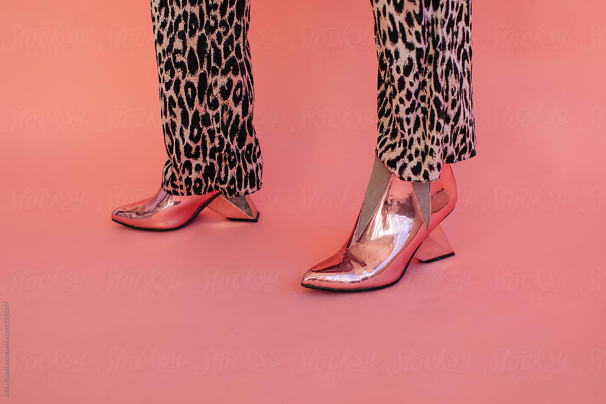 Shiny pink boots and leopard pants