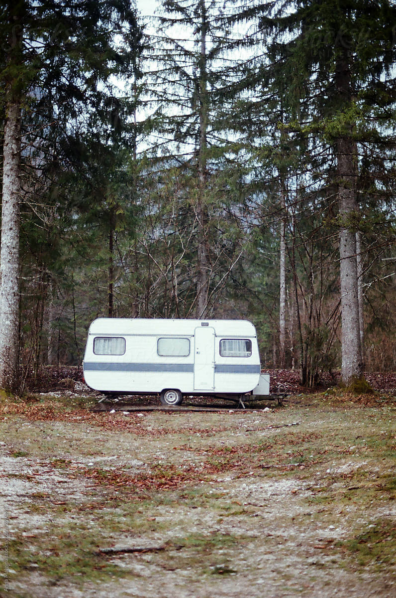 a lonely caravan in a forest