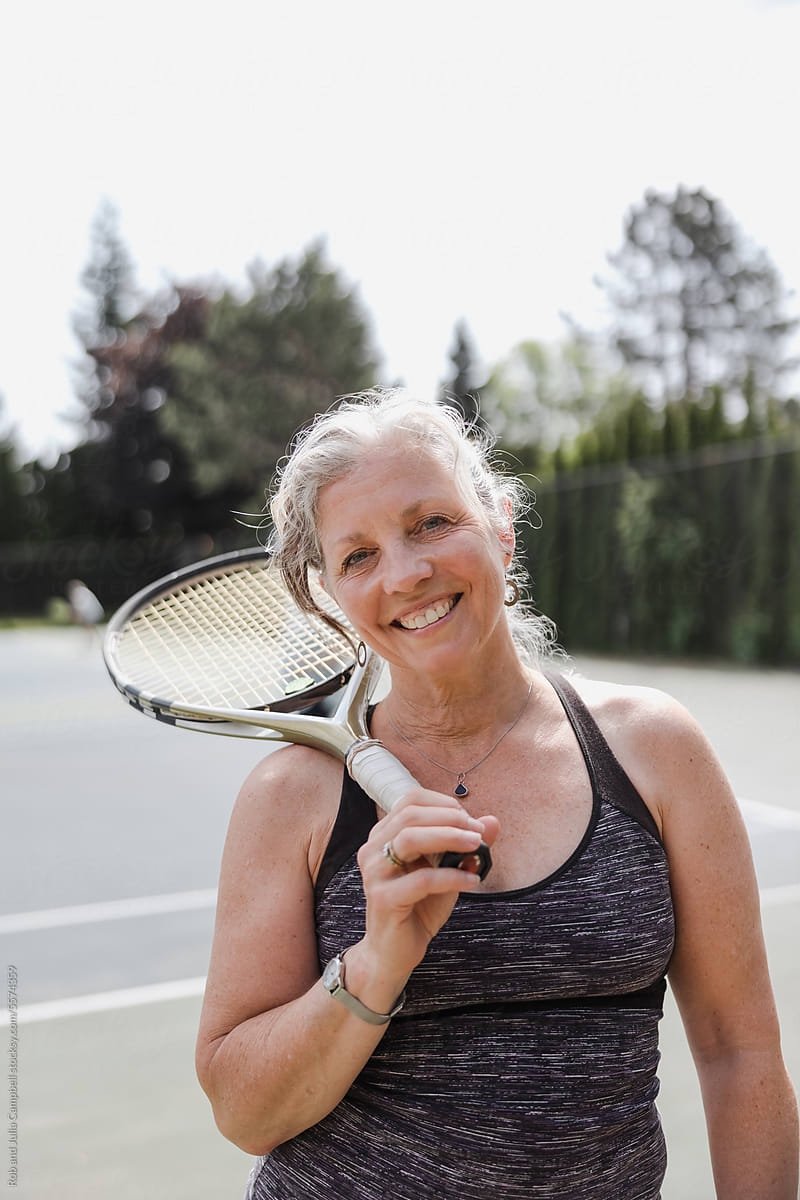 Portraits of casual women tennis player outside in the sunshine.