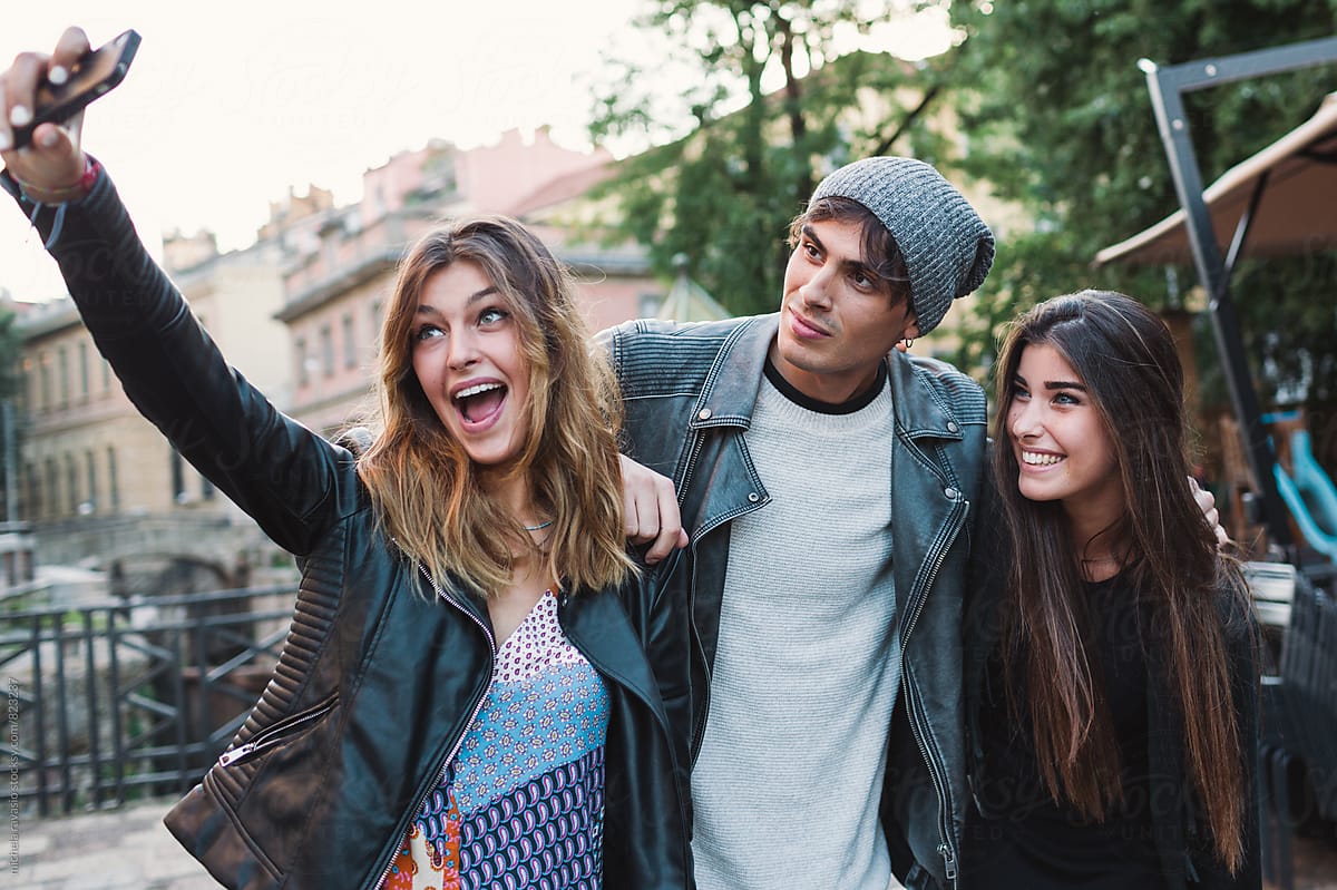 Smiling Friends Taking A Selfie Together By Stocksy Contributor