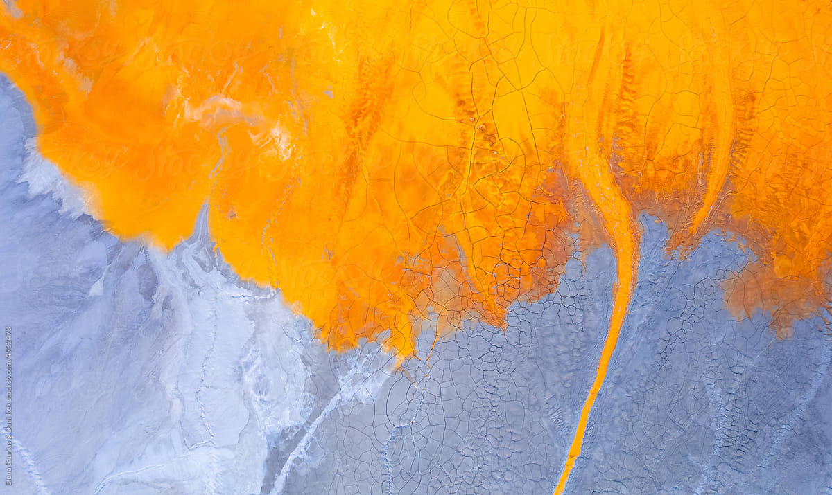 Abstract flowing rivers on vibrant orange, blue, red colors. Top view
