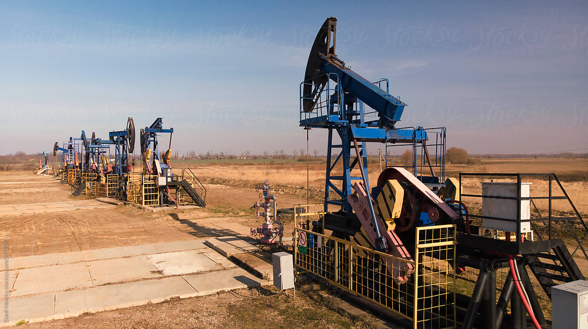 Countryside oil extraction facility in evening