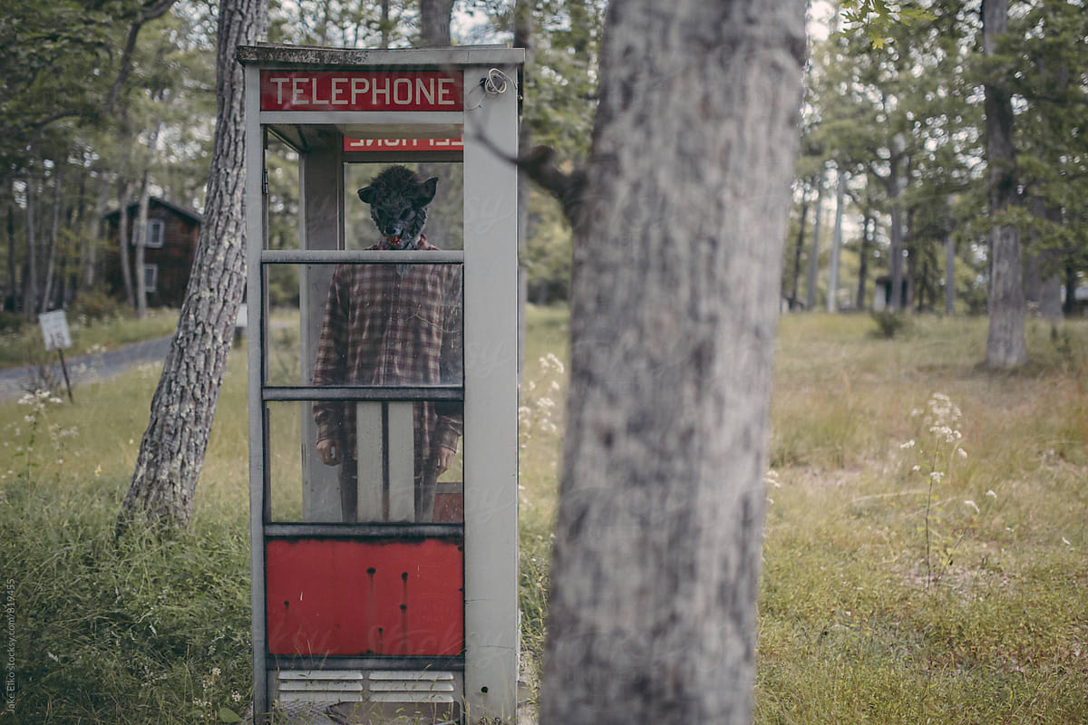 Creepy Abandoned Resort Man With Mask in Phone Booth