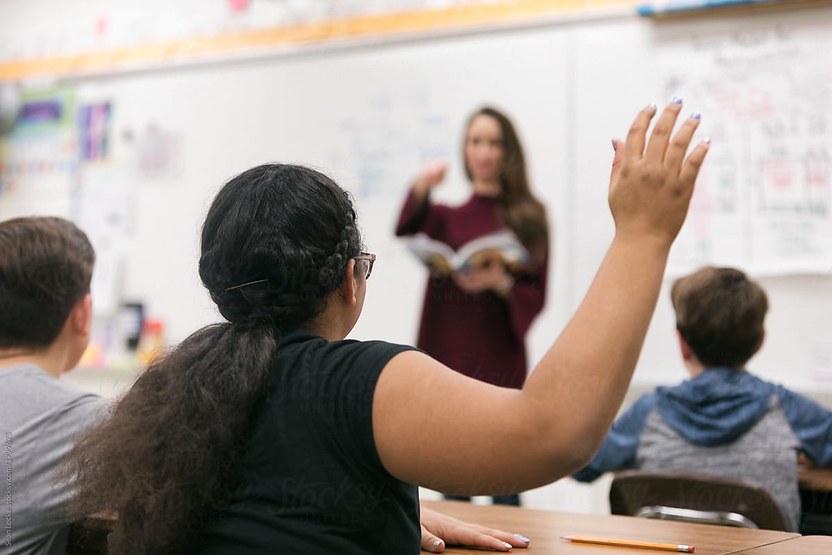 Classroom: Student Raises Hand With Question Or Answer