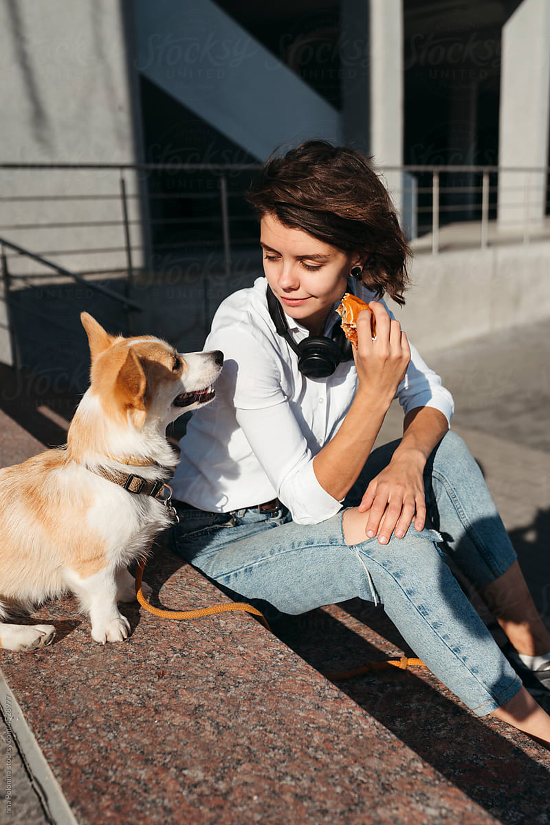 Happy young woman with dog.