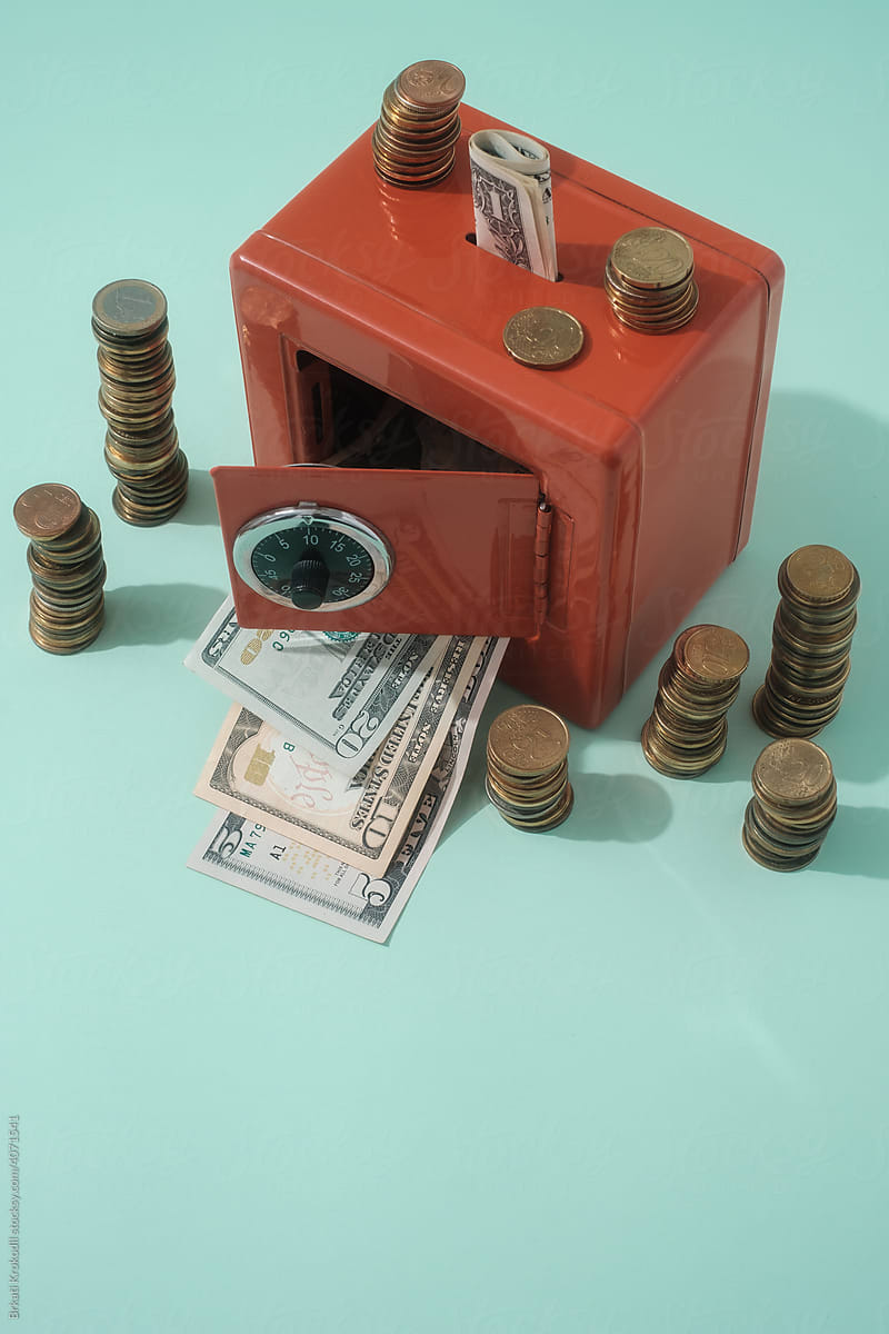 Red Money Safe Box With Dollar Bills And Euro Coins