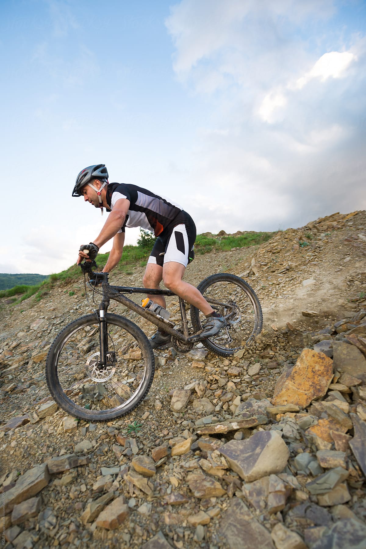 Man Riding A Mountain Bike In Downhill Style Del Colaborador De Stocksy Ibex Media Stocksy