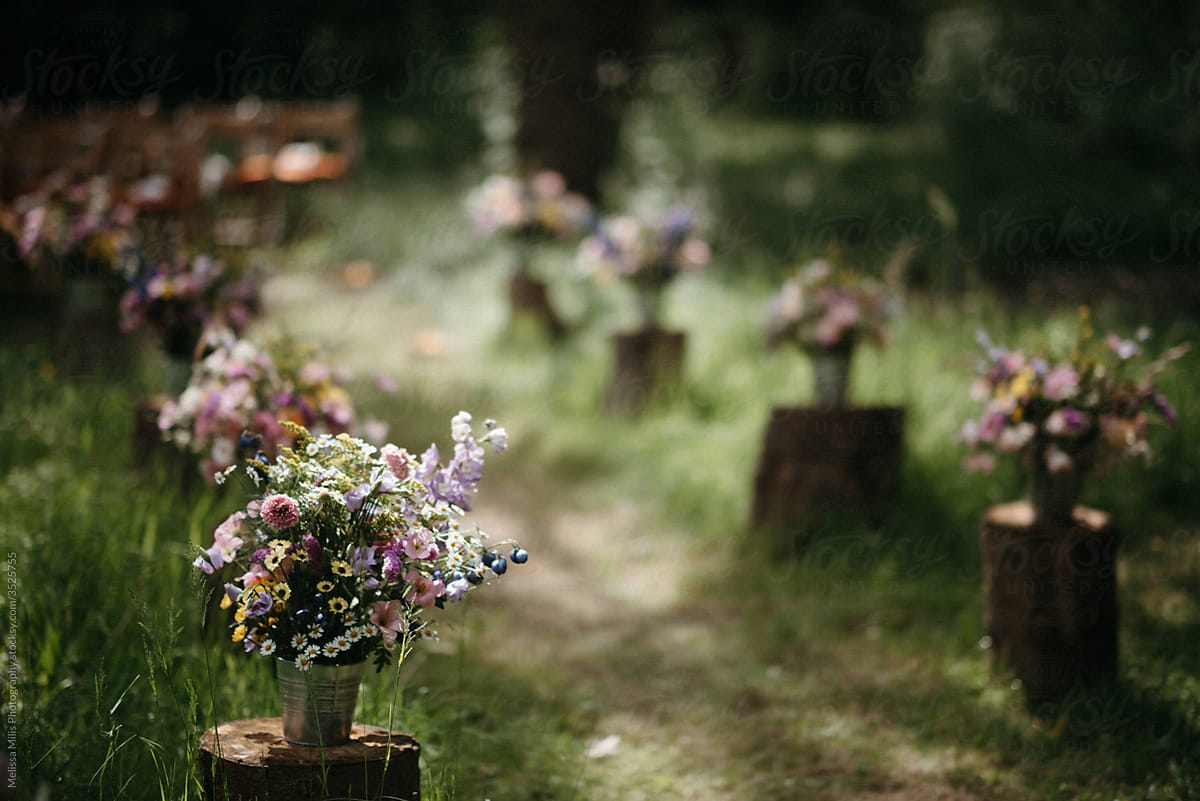 flower bouquets making a wedding aisle