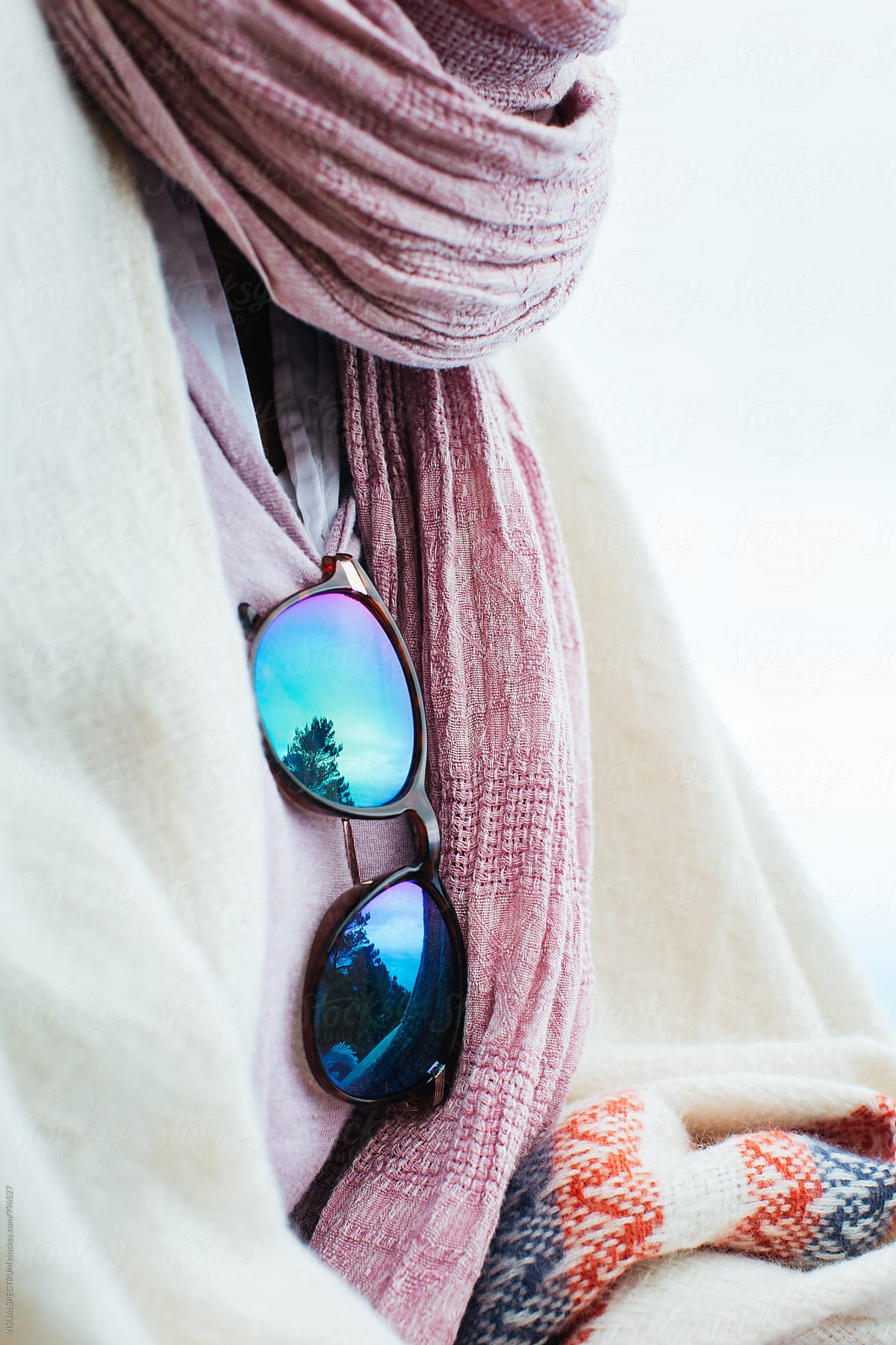 Close Up of Mirrored Sunglasses on Well-Dressed Woman