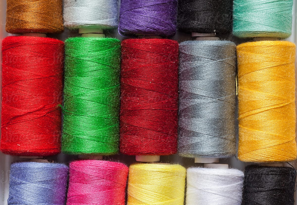 Colorful yarn thread rolls background
