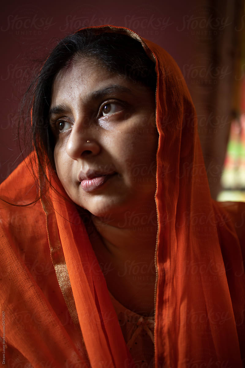 Indian woman portrait in veil inside room