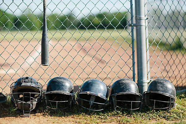 young baseball player sits on the bench by Stocksy Contributor Kelly  Knox