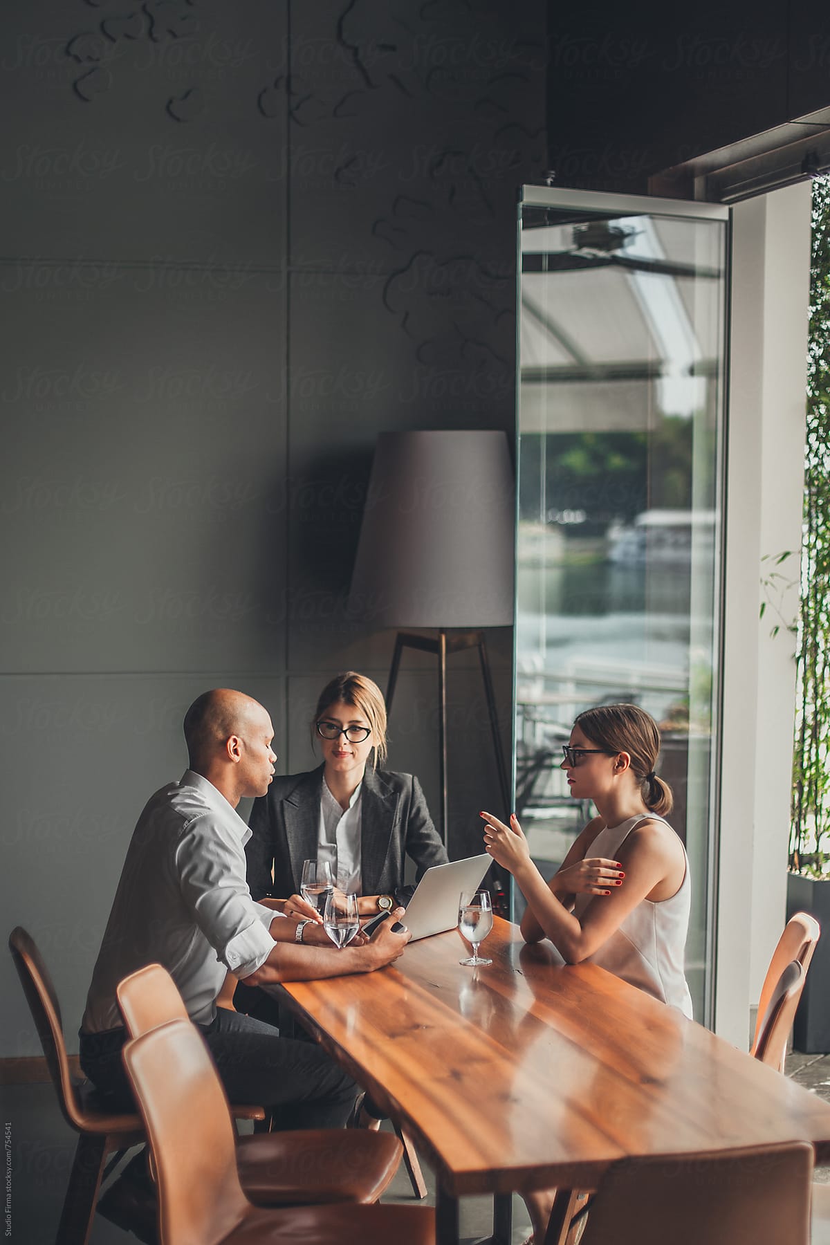Business People Discussing Ideas By Stocksy Contributor Studio Firma