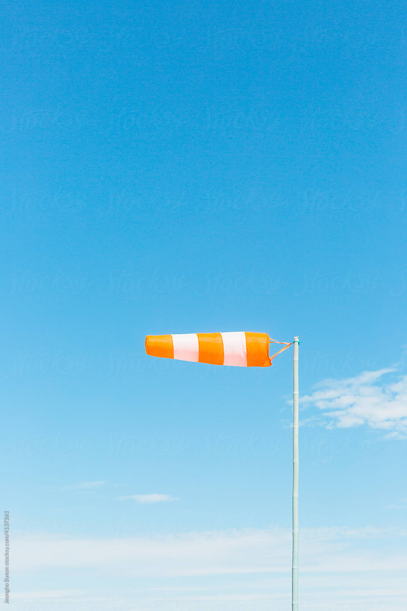 Sunny sky and wind direction flag.