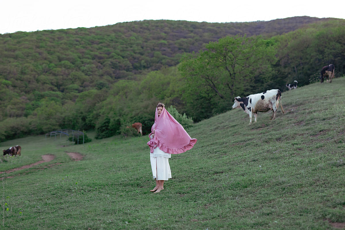 a woman in a pink cape