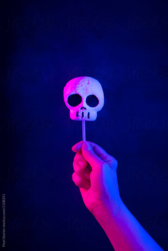 Hand holding candy skull