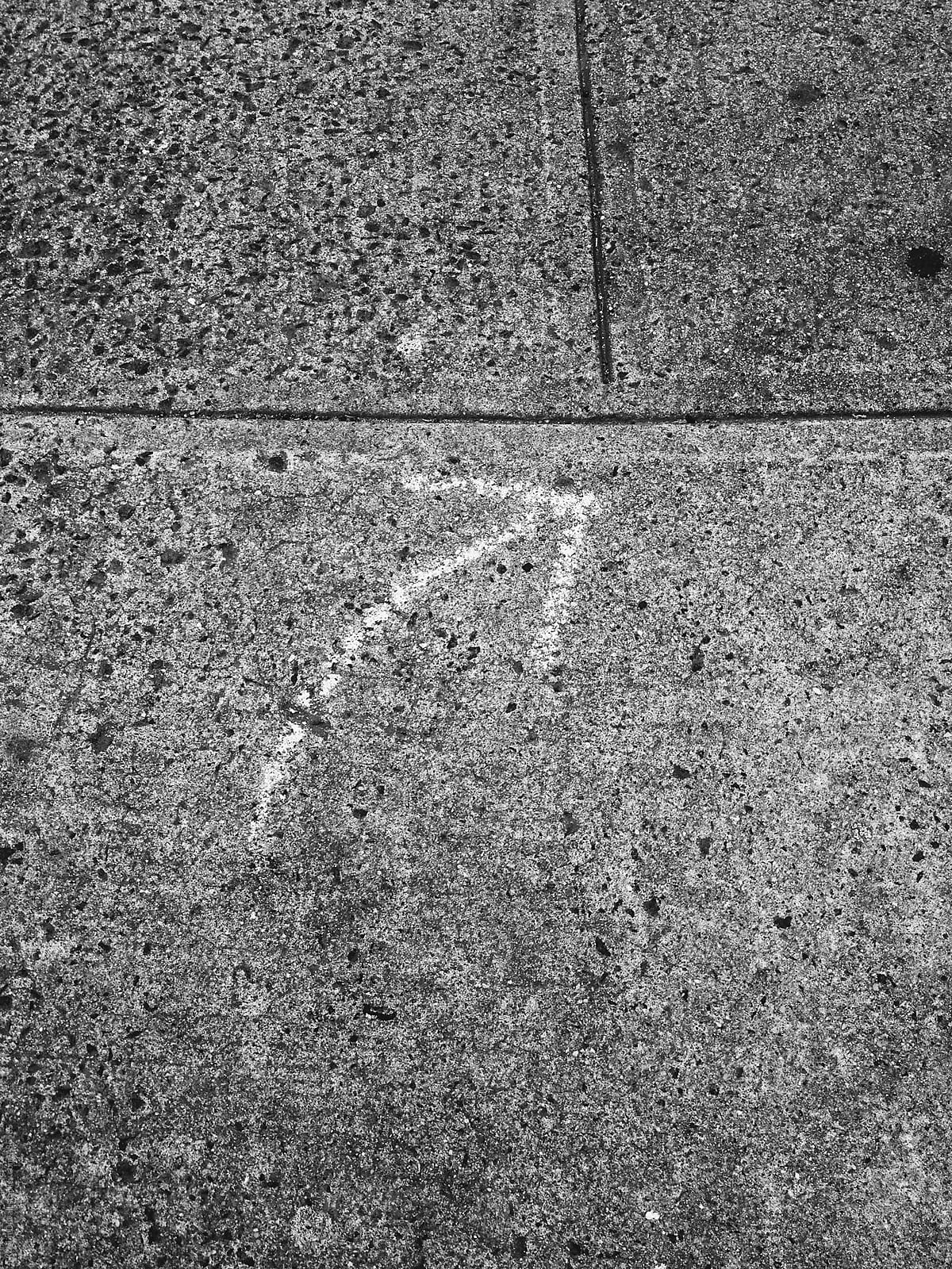 Arrow drawn on sidewalk