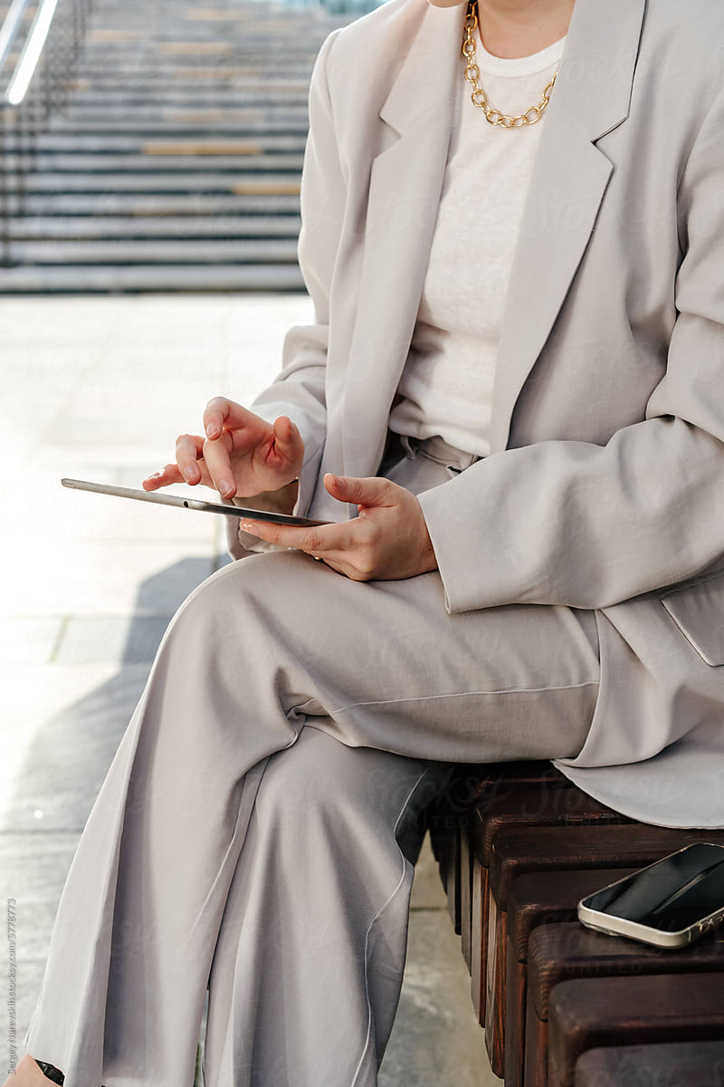 Close-up of anonymous businesswoman with digital tablet