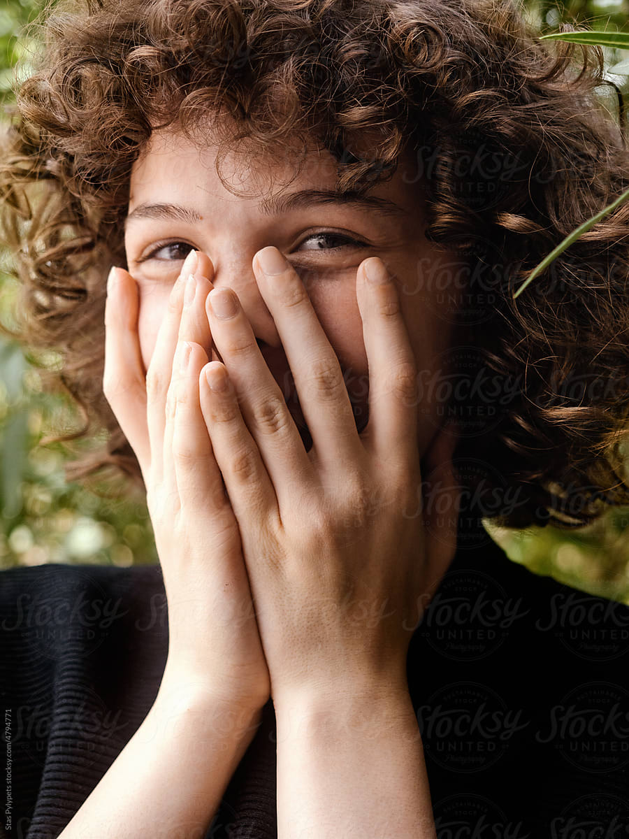 Beautiful curly girl laughing