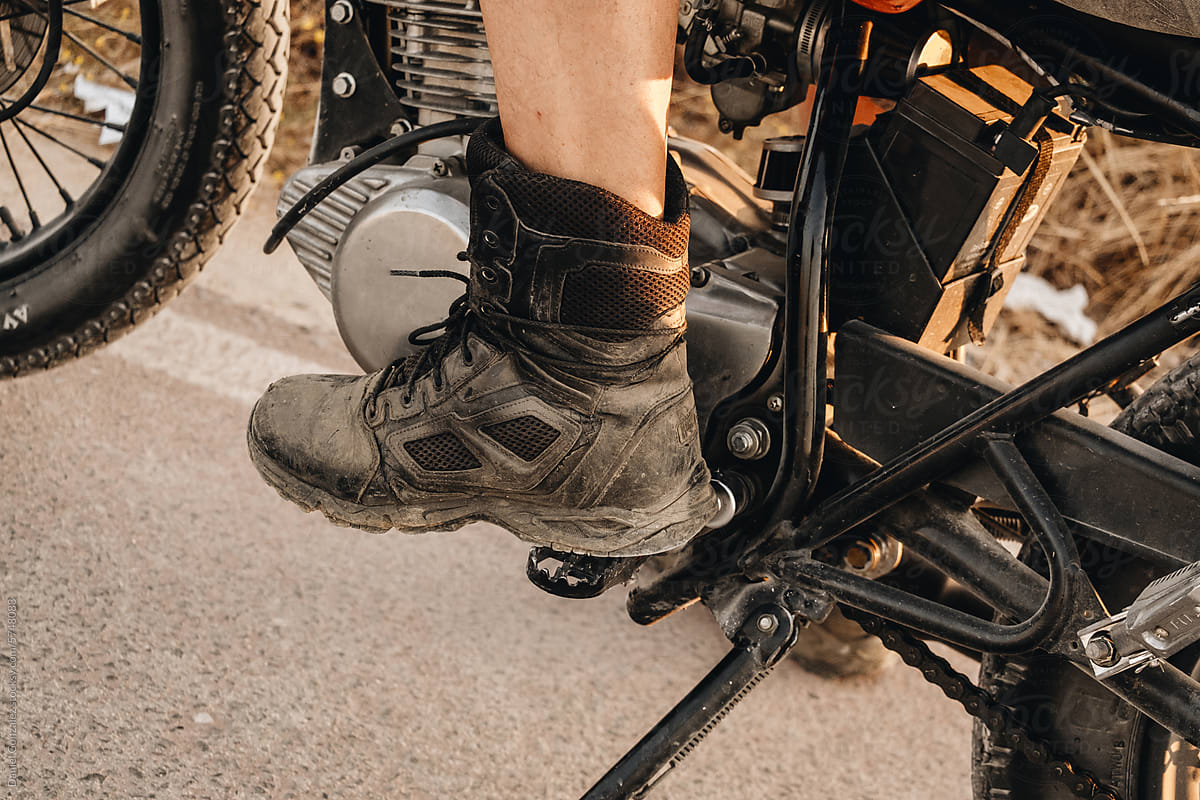 A biker\'s boot on his motorcycle