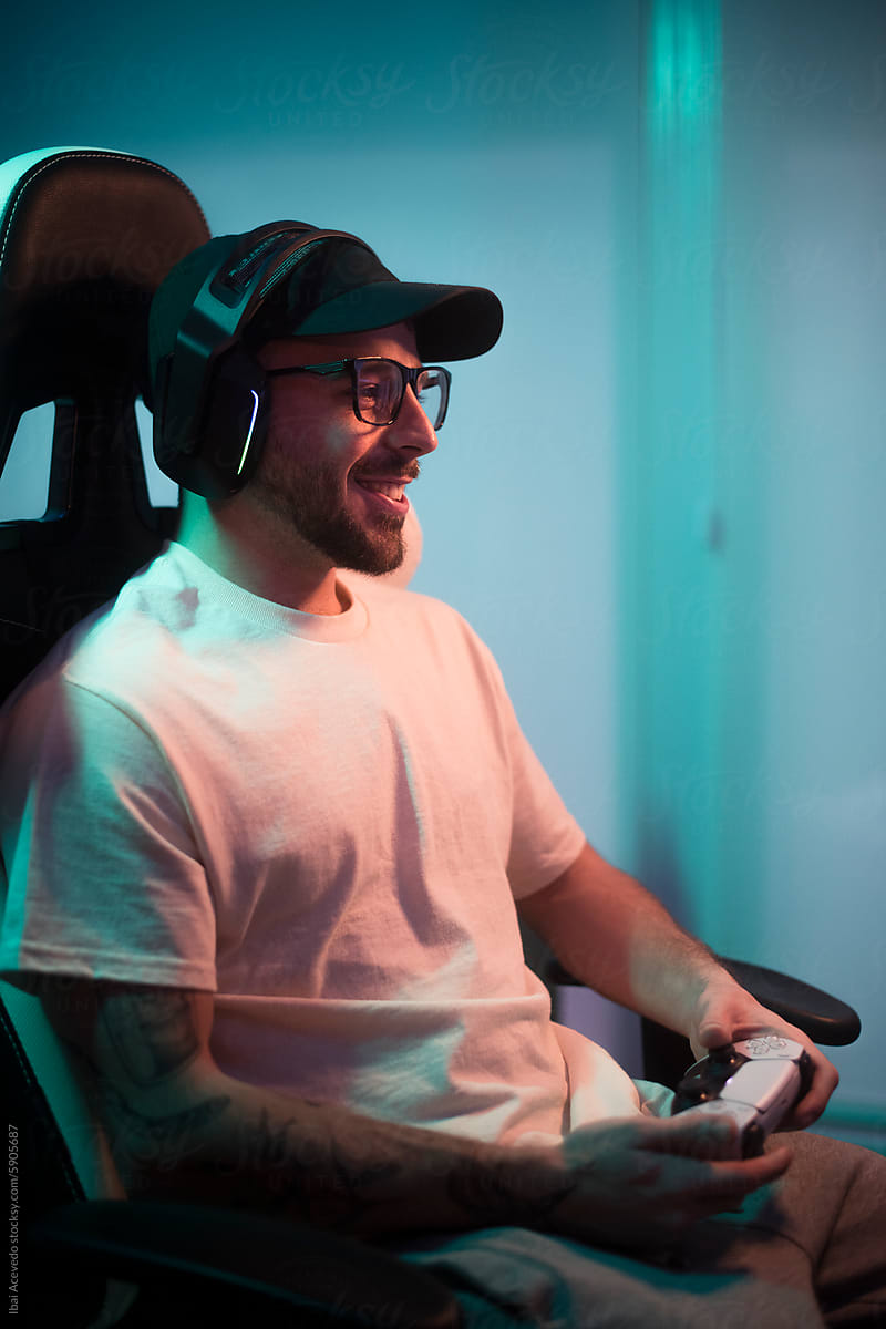 Smiling gamer playing console video games