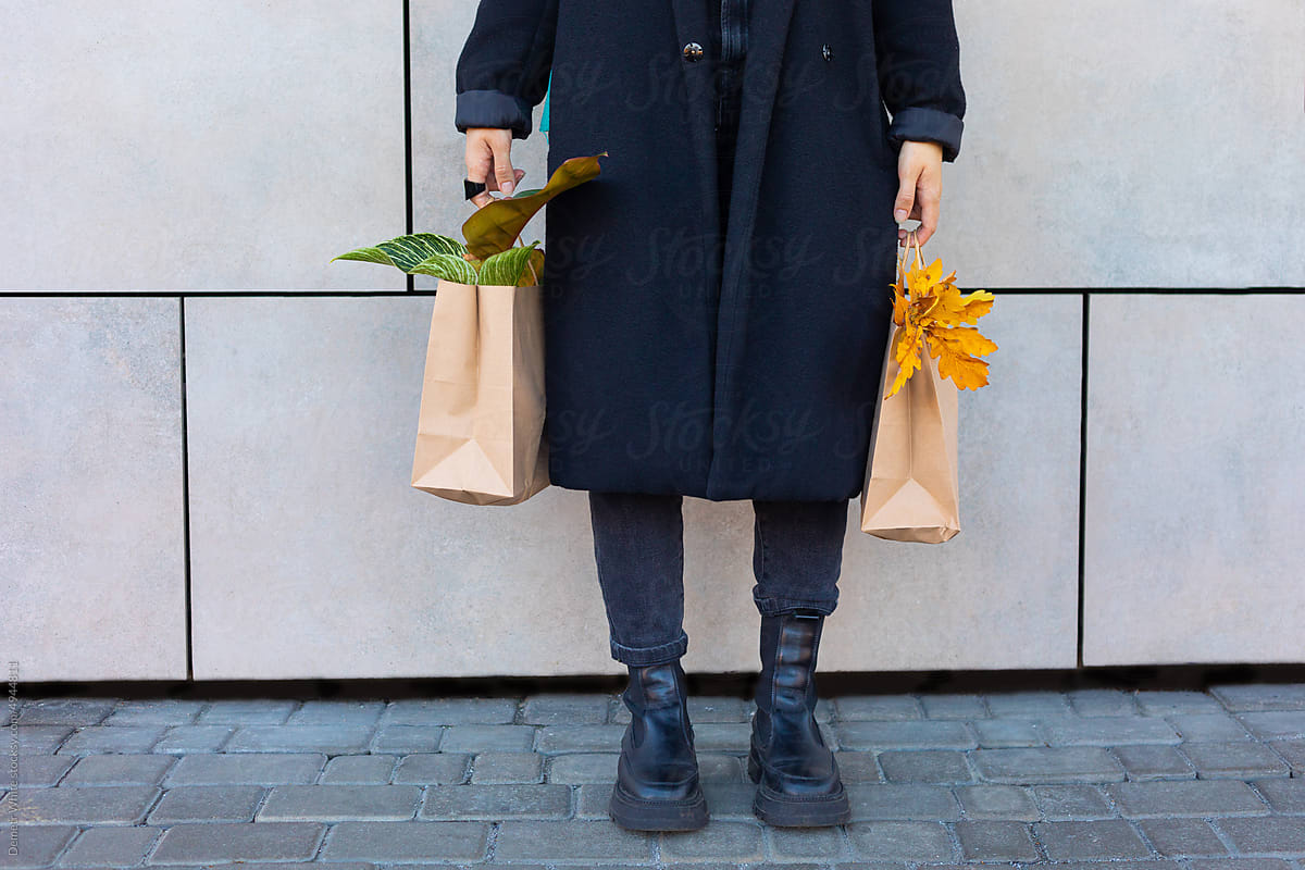 female hands holding two packages