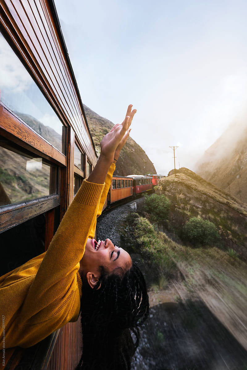 Girl Pulling Her Arms Up Through The Window Of A Train By Kike Arnaiz