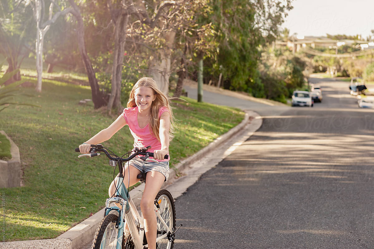 Tween Girl Riding Her Bike On The Road By Gillian Vann