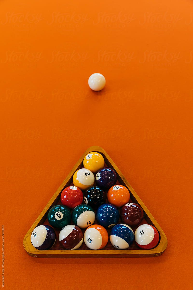 Billiard Balls on Orange Pool Table