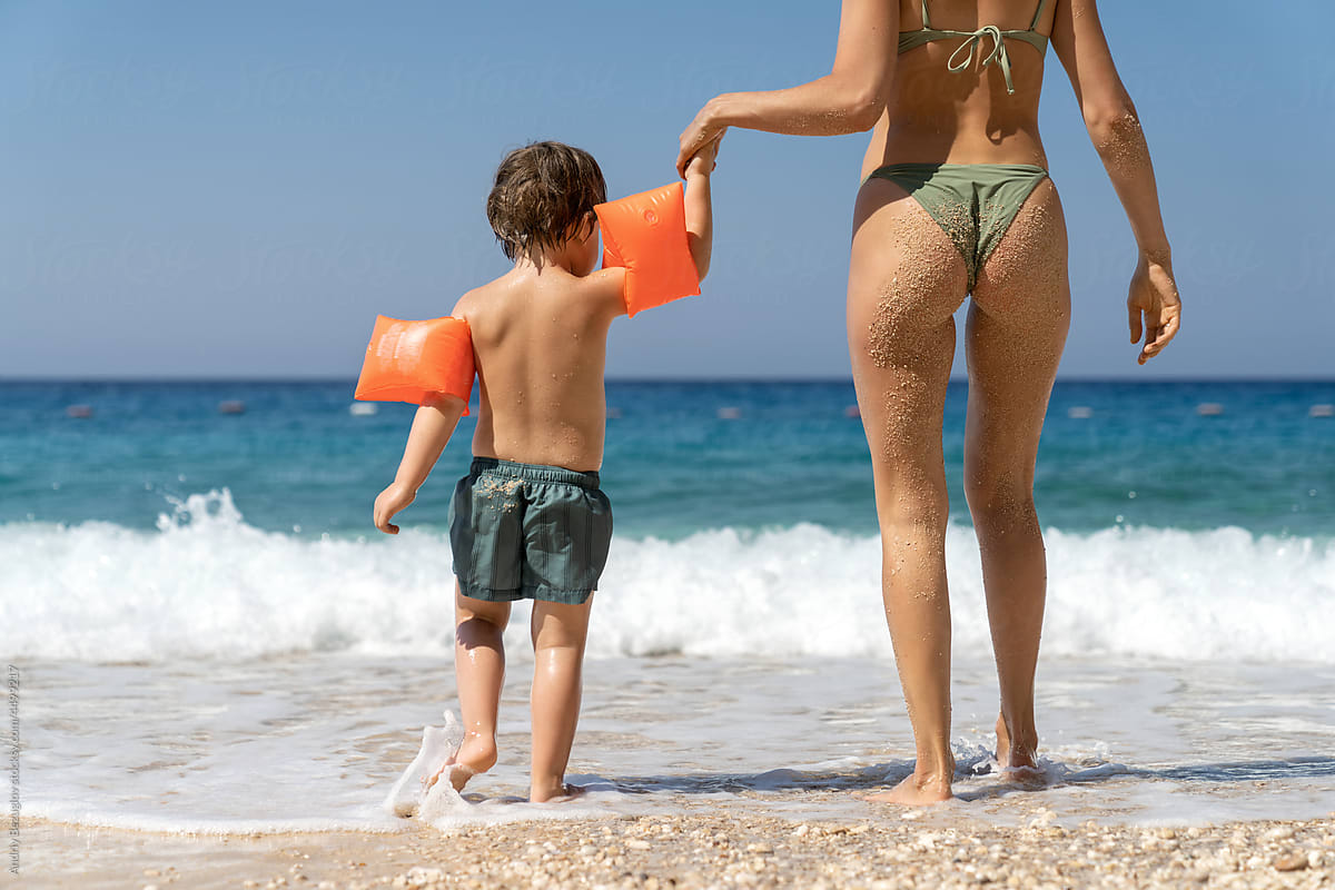 Woman with her son relaxing on sea beach