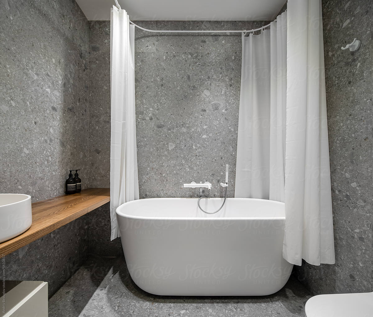 Bathroom in contemporary style with tiled walls
