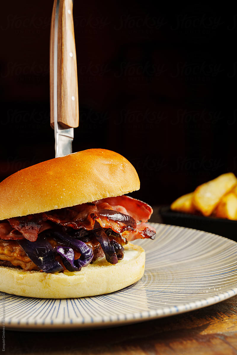 Appetizing burger with bacon and onion