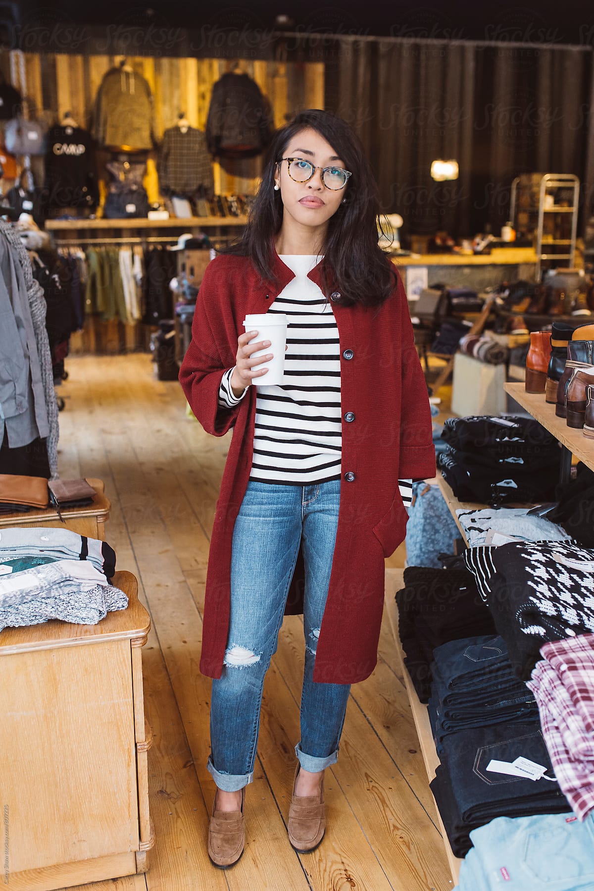 Stylish woman shopping at local clothing store