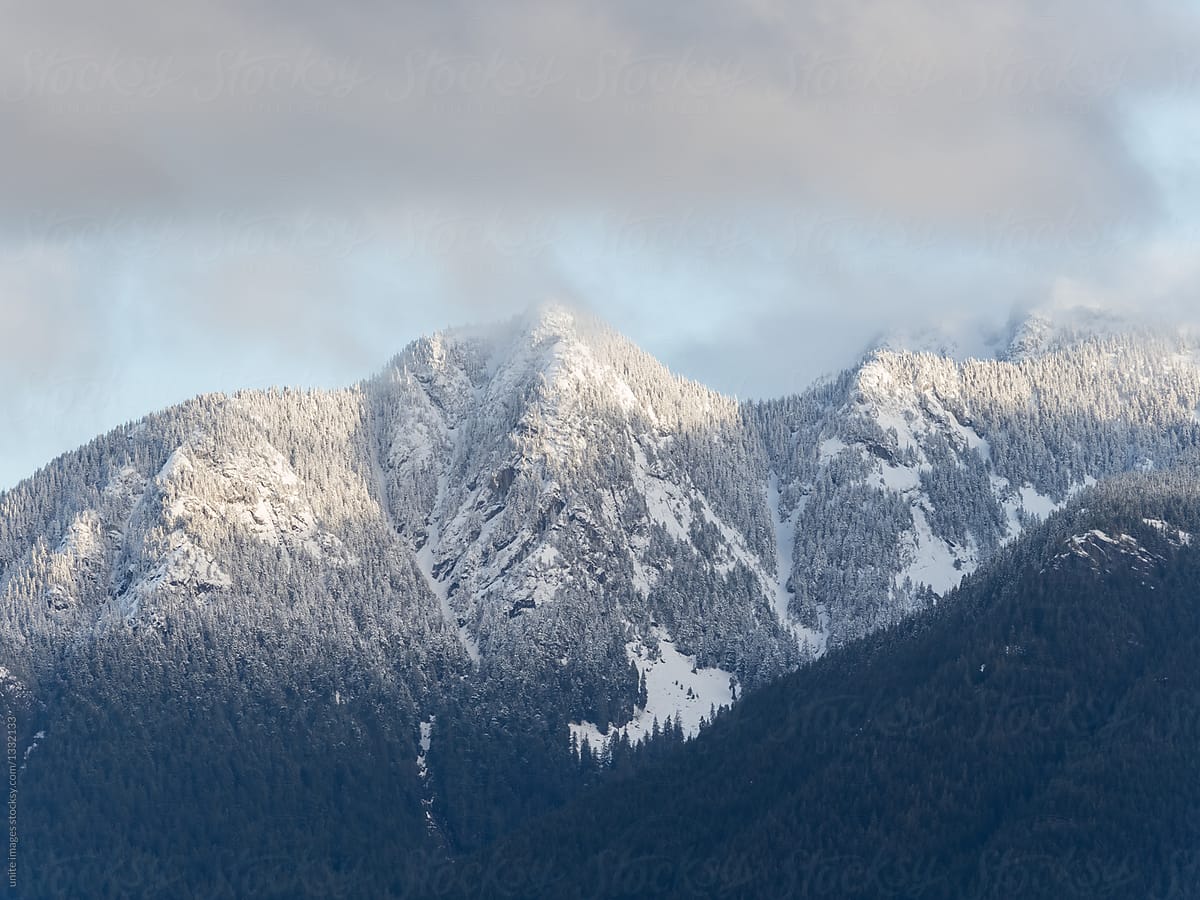 snow-capped mountain peak against cloudy sky,vancouver