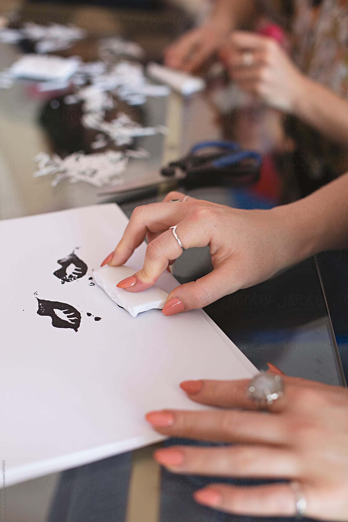 Close up of anonymous hands making homemade rubber stamps