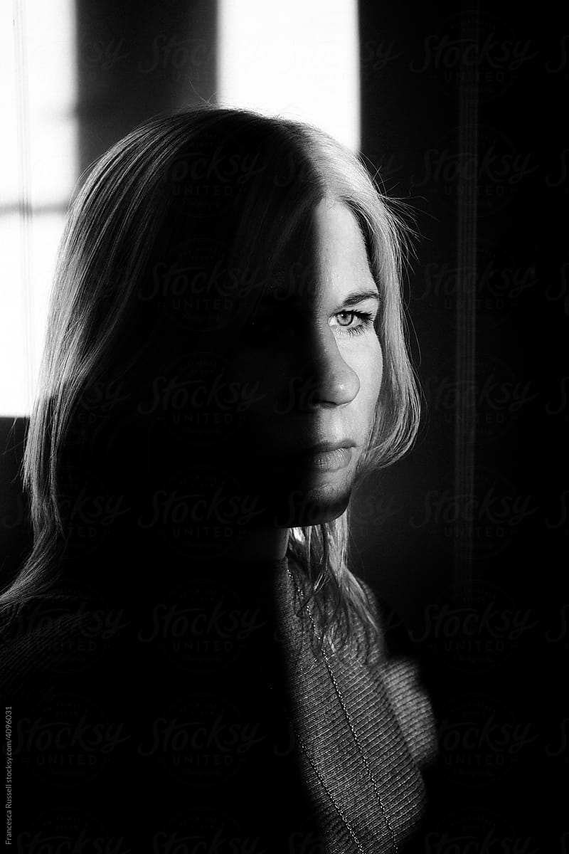 Woman in shadow and light - monochrome.