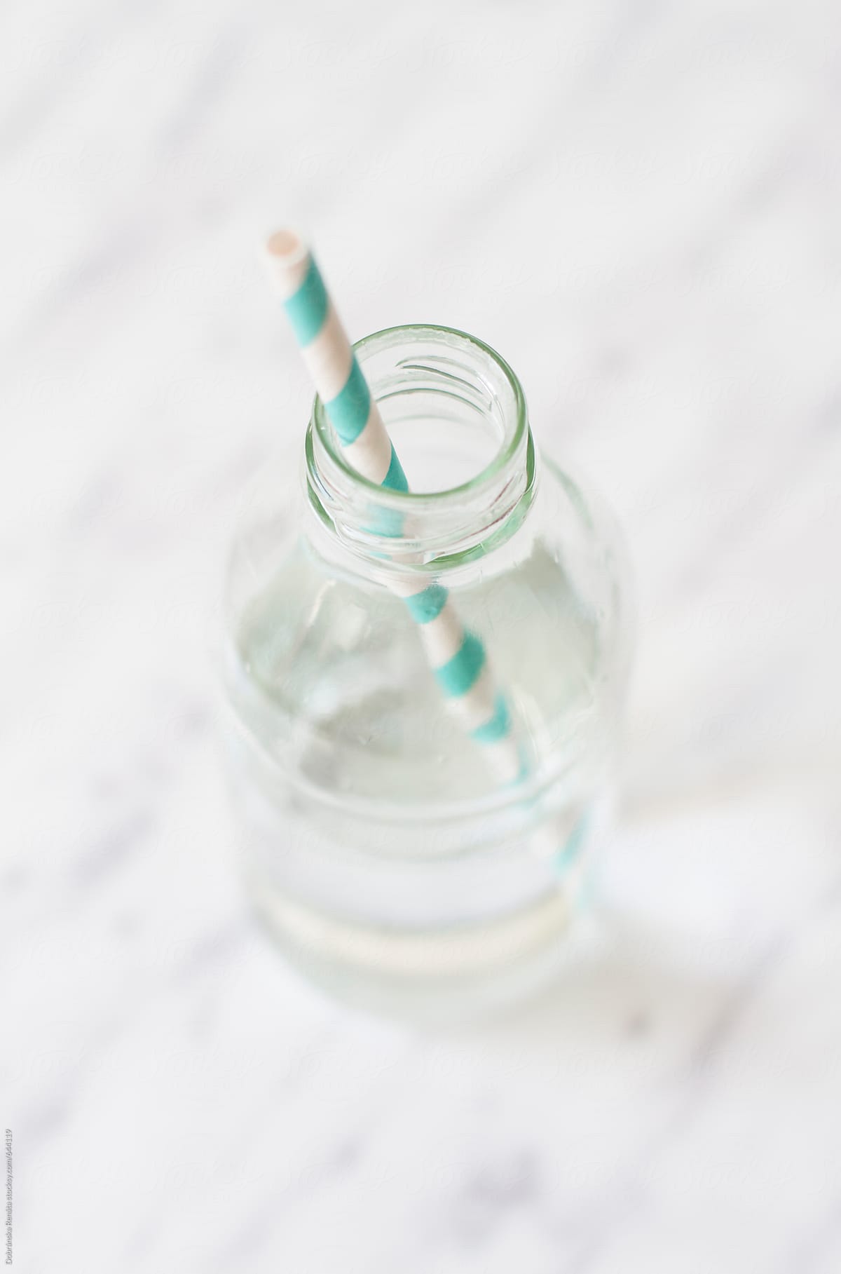 A straw in a bottle of water