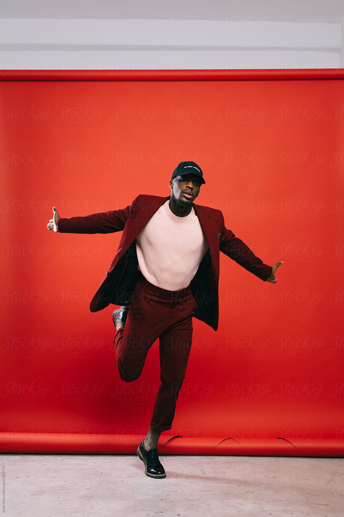 Black man in suit dancing